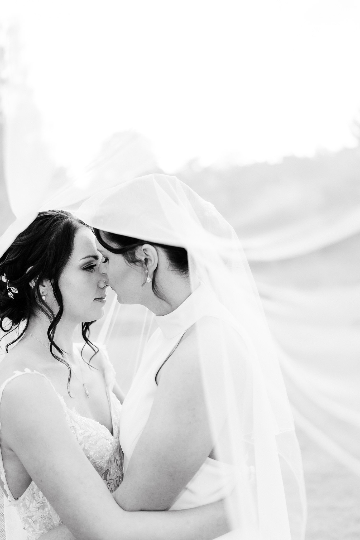 LGTBQ Wedding Photographer | Shrigley Photography & Film - SHRIGLEY two brides kissing under a veil in black and white - Hertfordshire Wedding Photographer - Shrigley Photography & Films