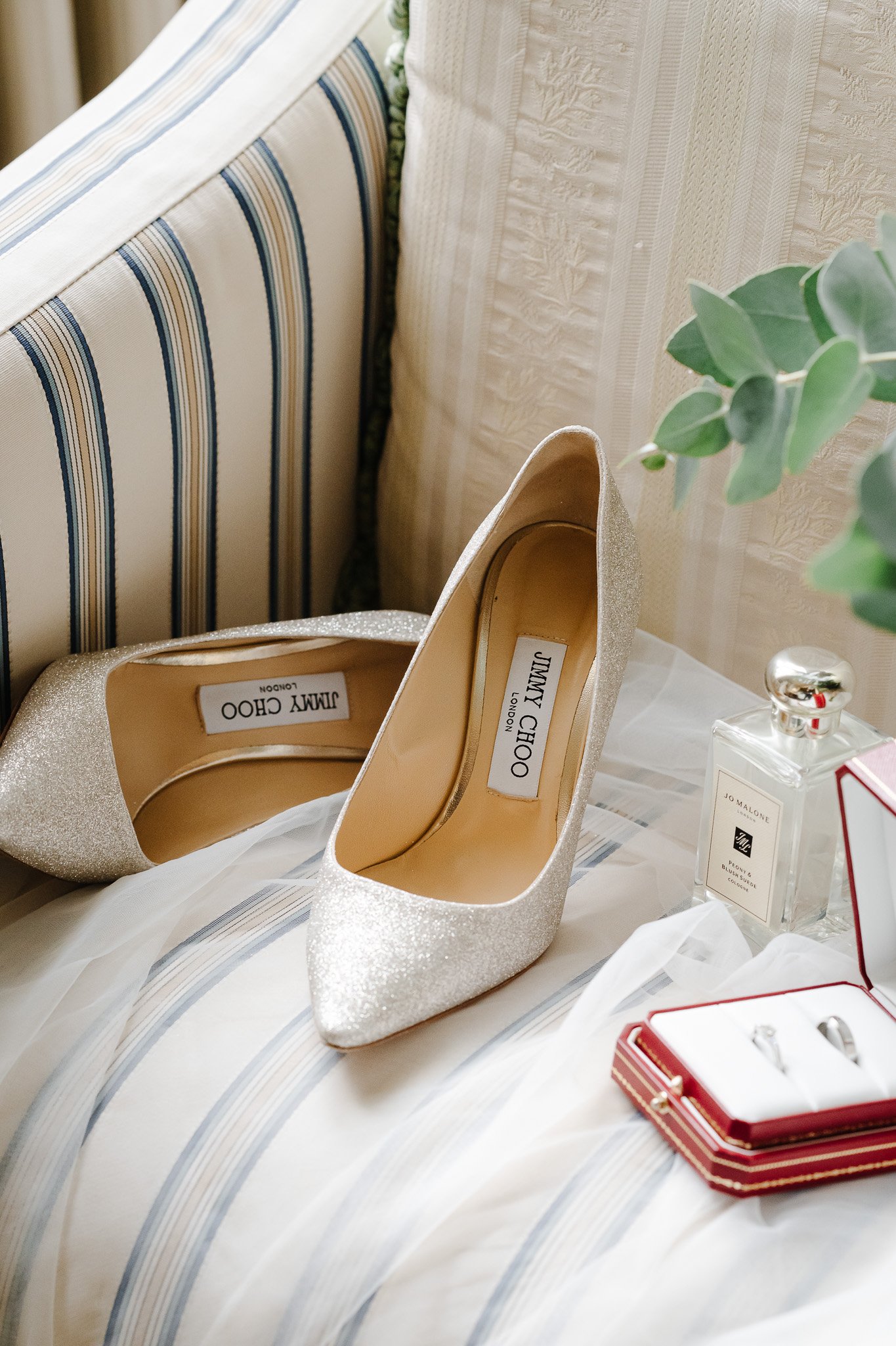 Hertfordshire Wedding Photographer & Filmmaker45 - SHRIGLEY Jimmy Choo silver stilettos shoes on a chair with jo malone perfume and cartier rings - Hertfordshire Wedding Photographer & Filmmaker - Brocket Hall Wedding - Shrigley Photography & Film