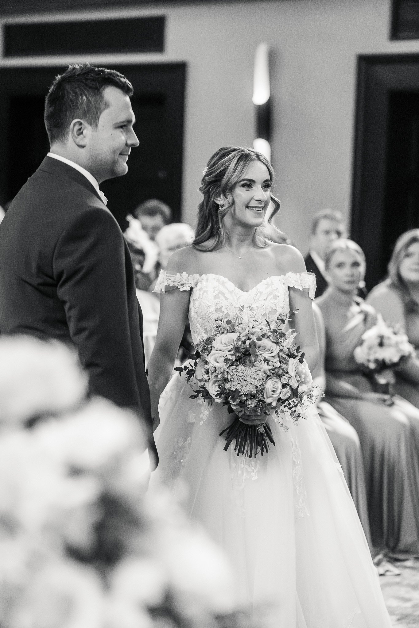 editorial wedding photographer Hertfordshire24 - SHRIGLEY Man and woman in church getting married holding hands with bouquet of flowers smiling - editorial wedding photographer Hertfordshire | Shrigley Photography & Film